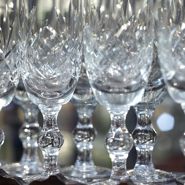a close up of a collection of antique glasses 