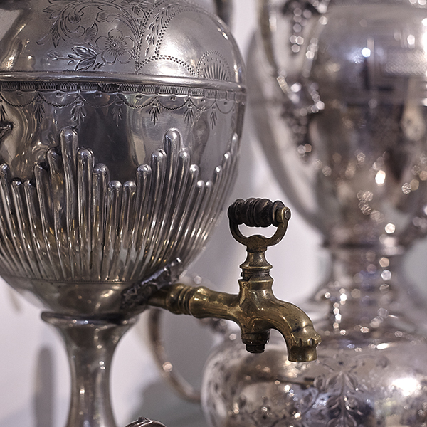 close up of antique silver urn