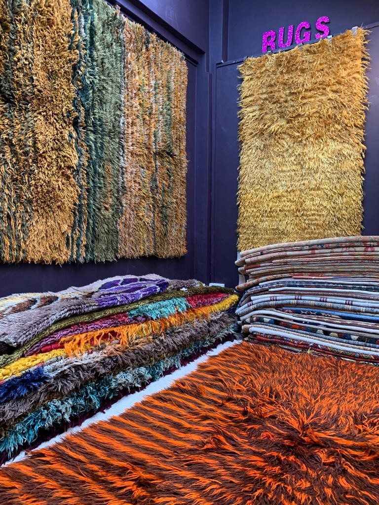 interior shot of lots of rugs