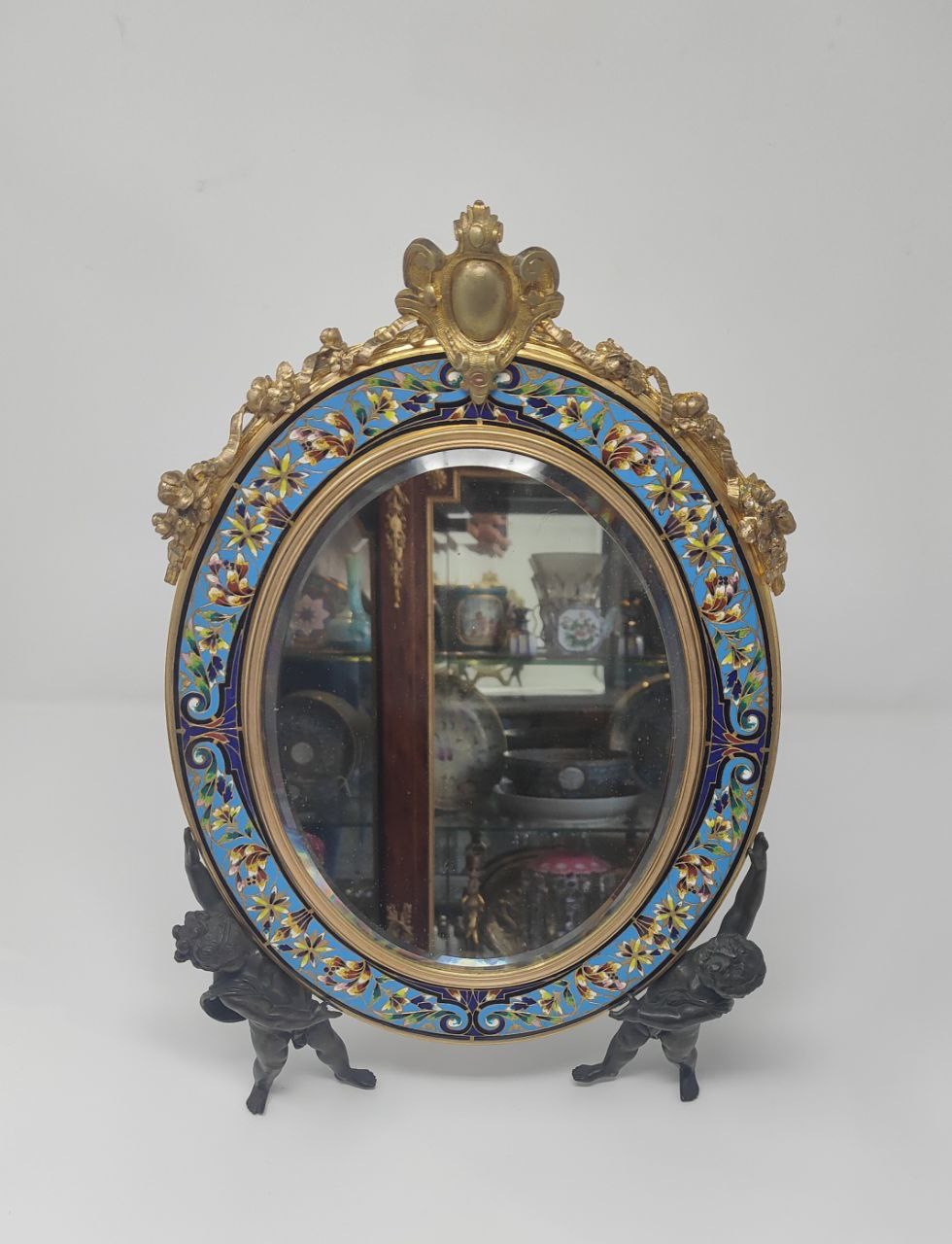 A champleve enamel and bronze mirror
